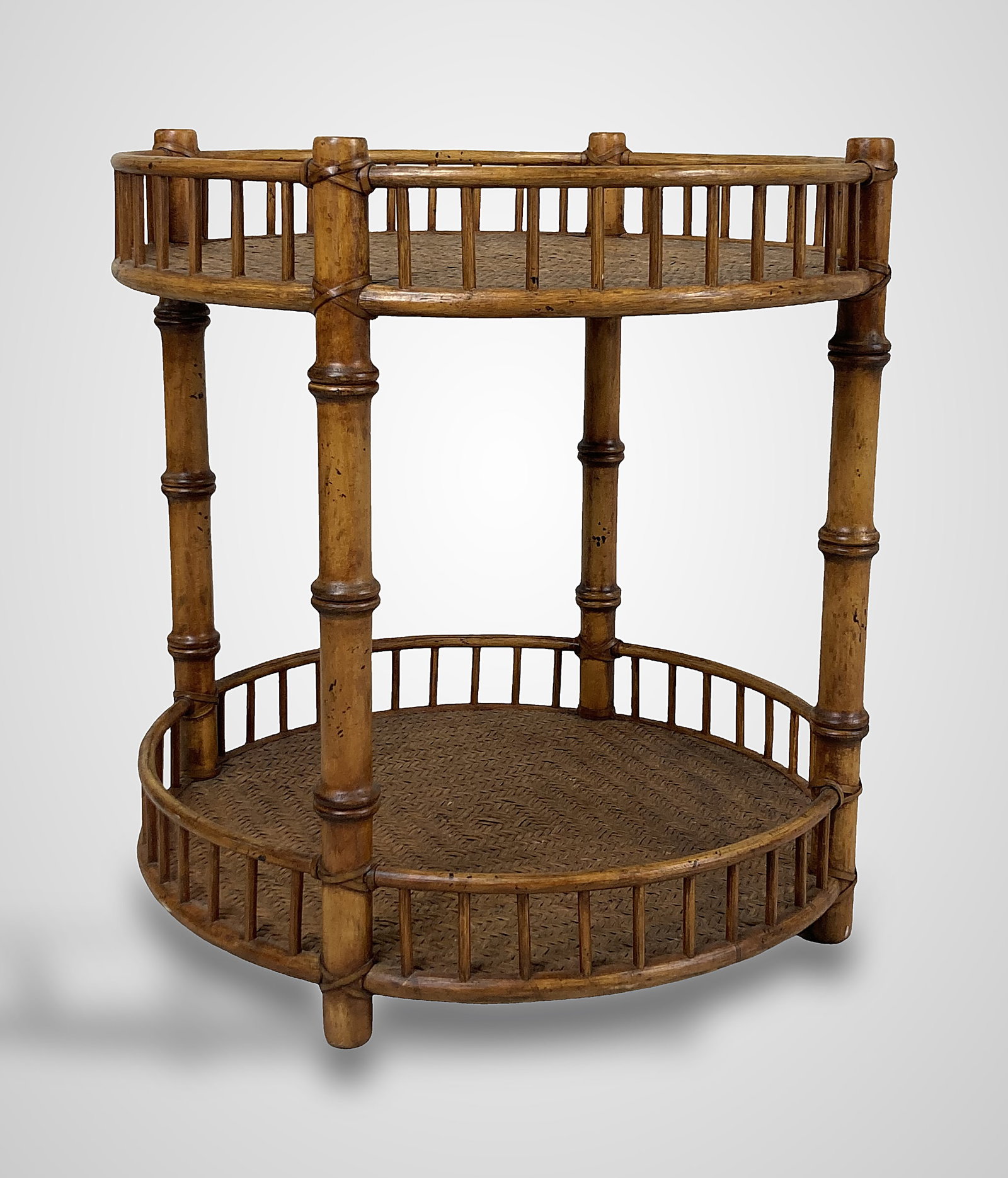 McGuire Bamboo and Rattan Two-Tiered Stand: Elegant piece features bamboo-style supports with fine turnings and woven rattan insets. The stand includes a gallery top and offers a sophisticated mid-century aesthetic, making it an excellent