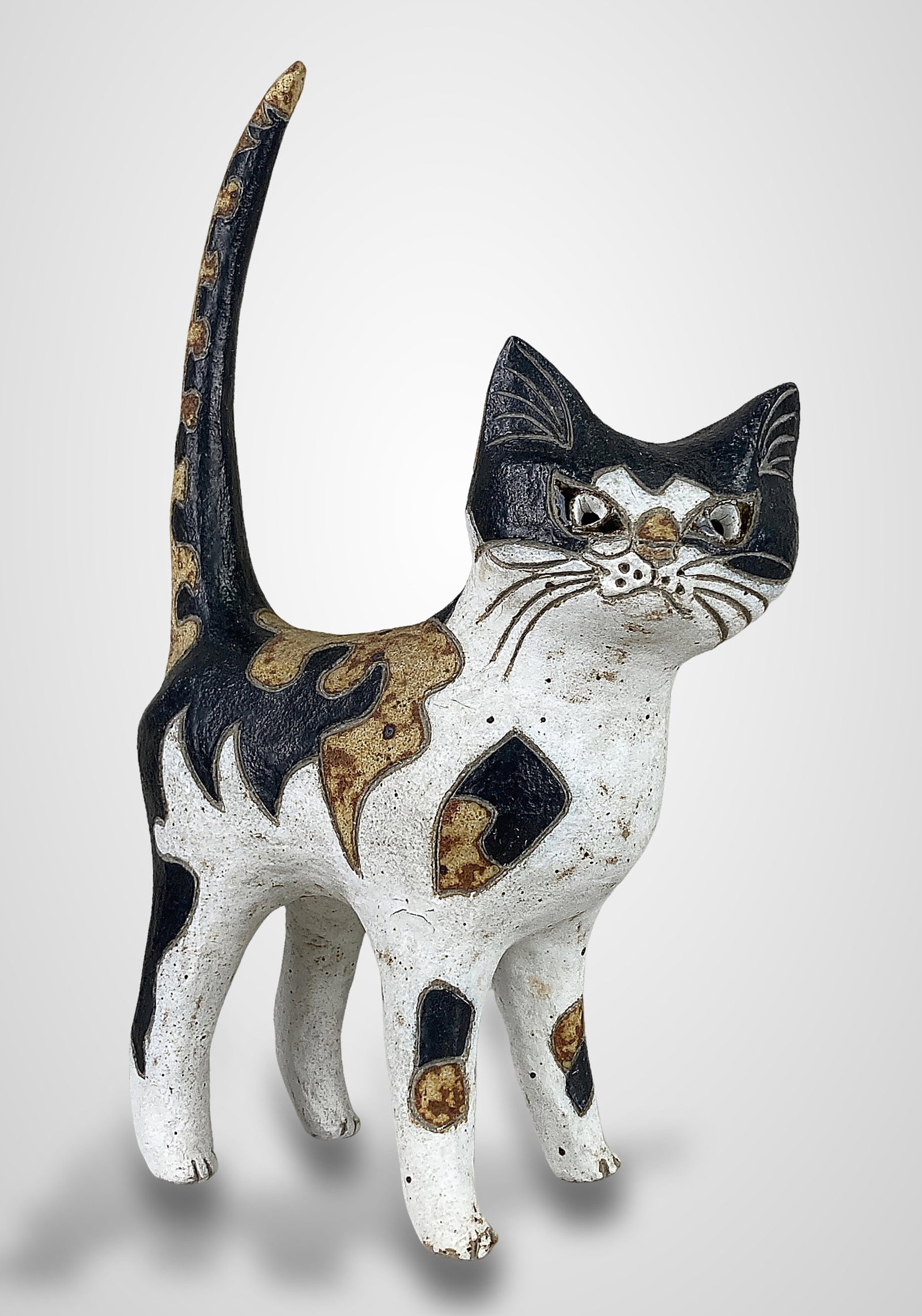 Rosemary Wren Stoneware Cat Sculpture: This Calico cat sculpture is the work of the renowned British studio potter Rosemary Wren (1922â€“2013), daughter of Denise Wren, with hand-painted details by Peter Crotty. The piece