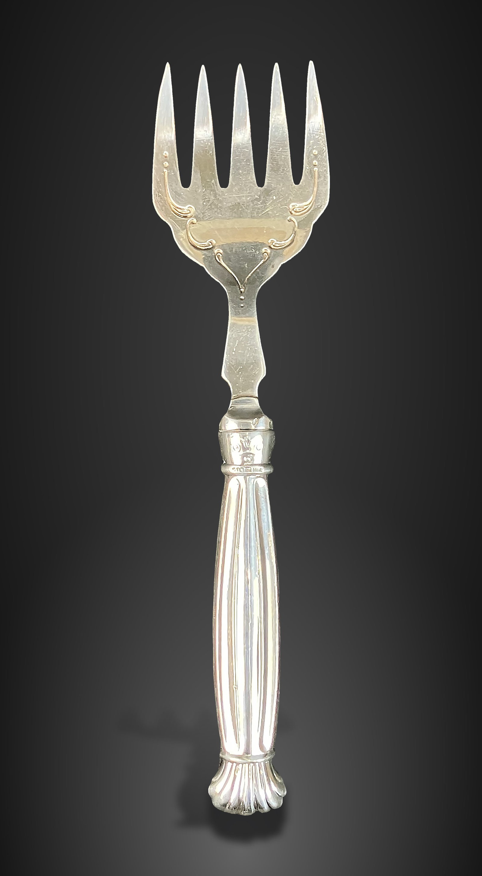Sterling Silver Handled Art Deco Sardine Fork: English Art Deco fork, produced by the Ambassador Manufacturing Company, features an elegant sterling silver handle. It measures approximately 6 1/4 in. H x 1 1/2 in. W x 1/4 in. D and is in good cond