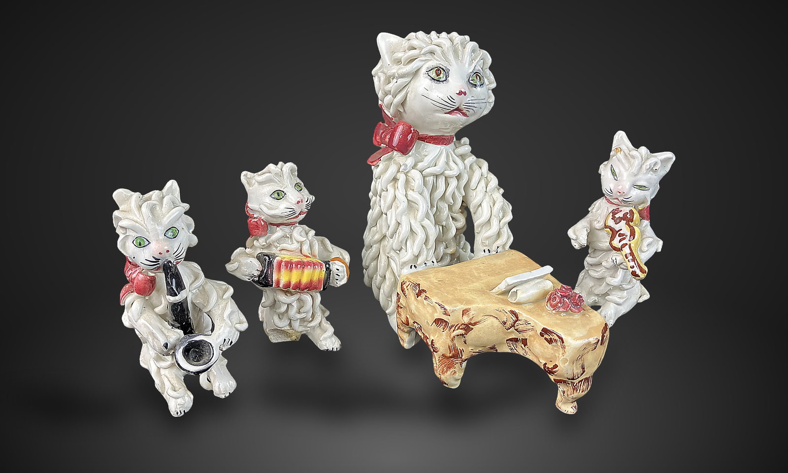 Mid-Century Italian Spaghetti Cat Band: Charming set features cats with distinct spaghetti style white fur, each playing a different musical instrument, including a piano and an accordion and more. The figures feature hand-painted details. 