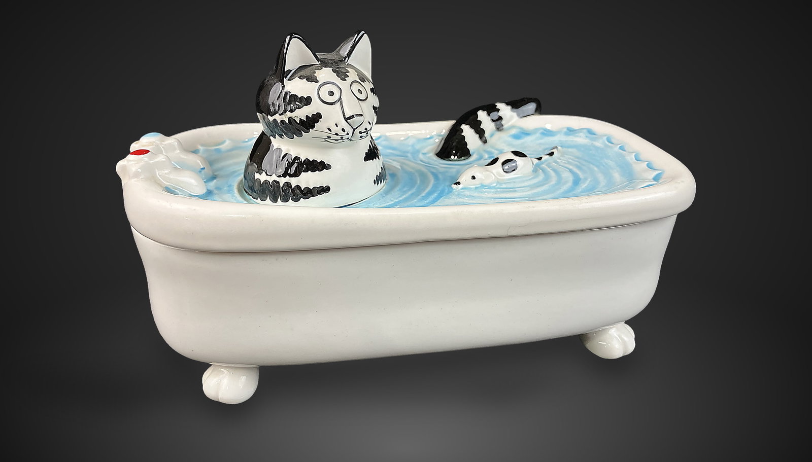B. Kliban Cat in Bathtub Trinket Box: Charming ceramic trinket box depicts a cat in a bathtub with a swimming mouse, rendered with B. Kliban's iconic black-and-white tabby style and whimsical features. Produced by Sigma Tastesetter in