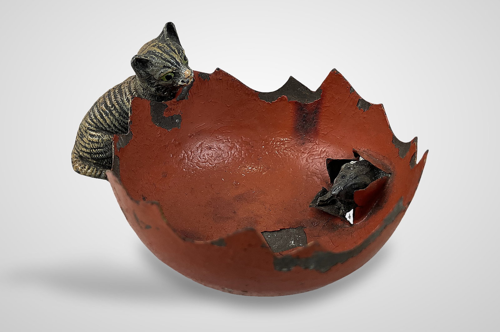 Austrian Cold-Painted Bronze Cat Trinket Dish: Piece of classic artistry captures a dynamic hunting scene, featuring a cat positioned alongside a red trinket dish with a mouse appearing to break through the side. The figurine measures