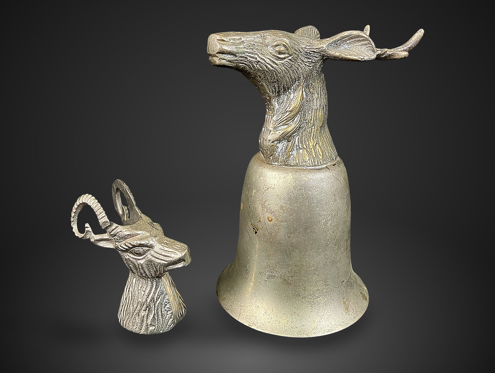 Stag Head Pewter Stirrup Cup: This handsome pewter stirrup cup is distinguished by an expertly cast stag head design. This group also includes a separate, smaller piece featuring a figural stag head. The primary stirrup cup