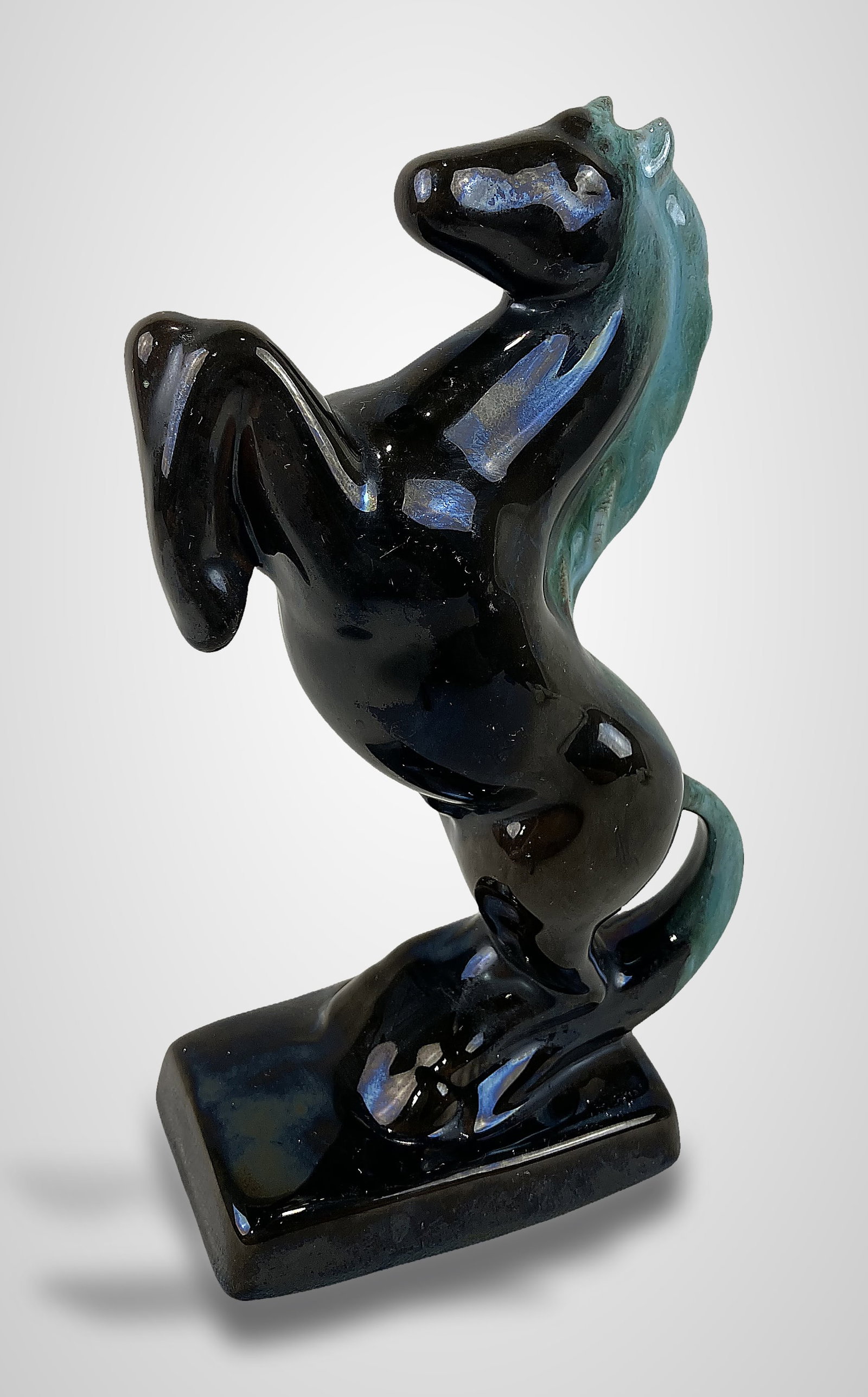 Blue Mountain Pottery Rearing Horse: This mid-century modern art pottery piece is attributed to the renowned Canadian studio Blue Mountain Pottery, which operated in Collingwood, Ontario, from 1953 to 2004. The sculpture depicts a