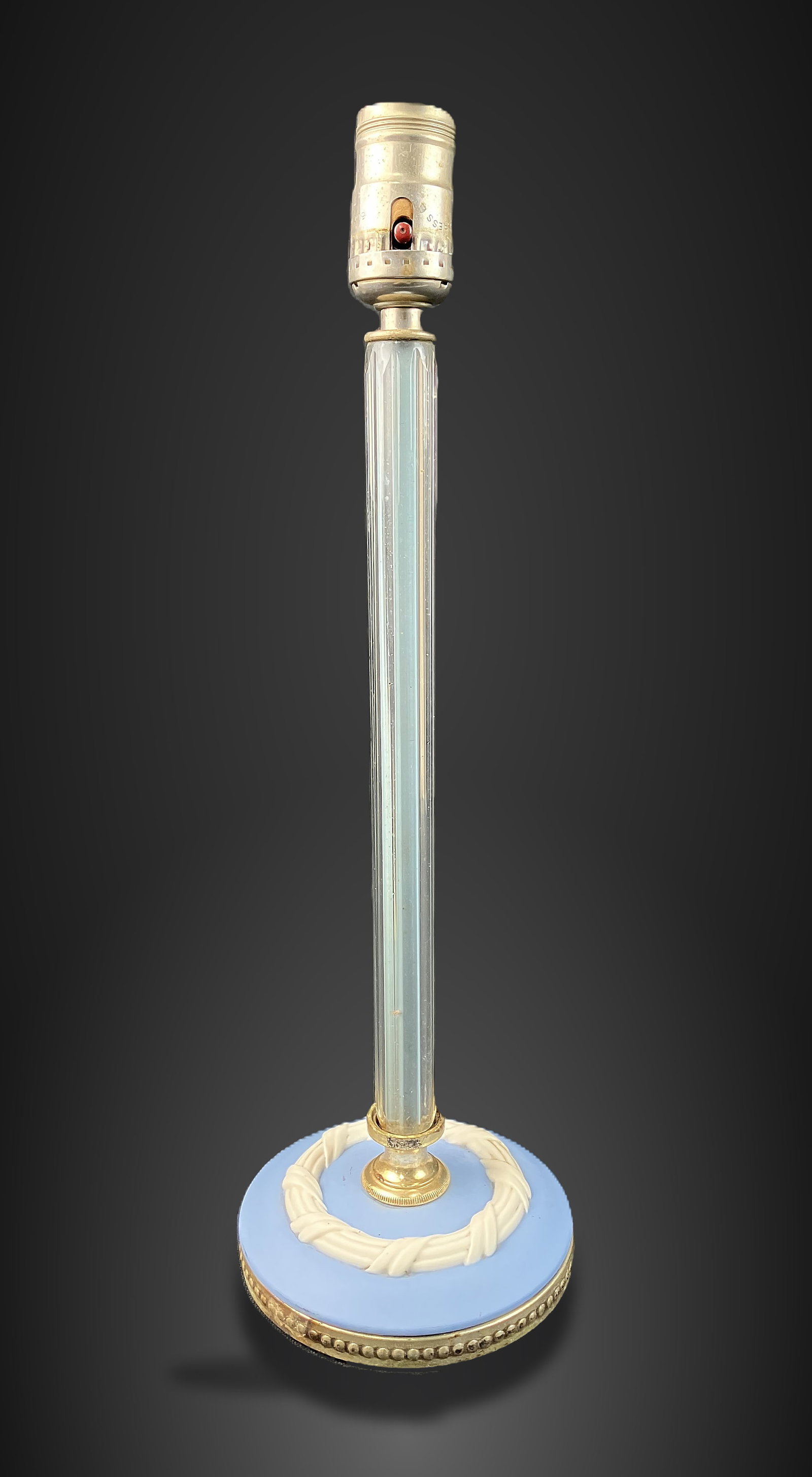 Jasperware Boudoir Lamp: Lamp features a classic, columnar form with a blue decorated Jasperware base and a clear crystal body. It measures approximately 15 3/4 in. H x 5 in. in diameter. The piece shows some surface wear