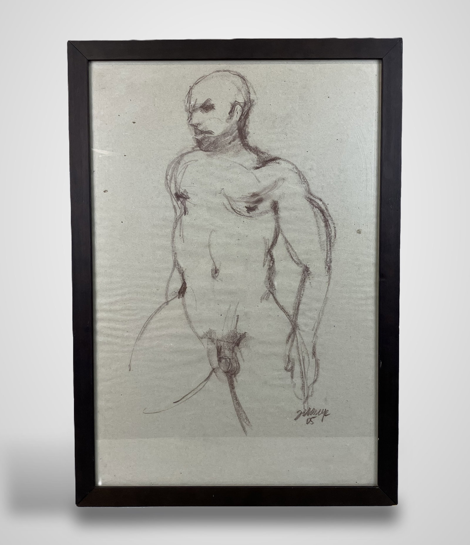 Figure Study, Conte Crayon Drawing: Figure study of a nude man is executed with precise, expert gestural linework in toned contÃ© crayon, likely on newsprint sketch paper. It is housed in a brown wood frame that complements