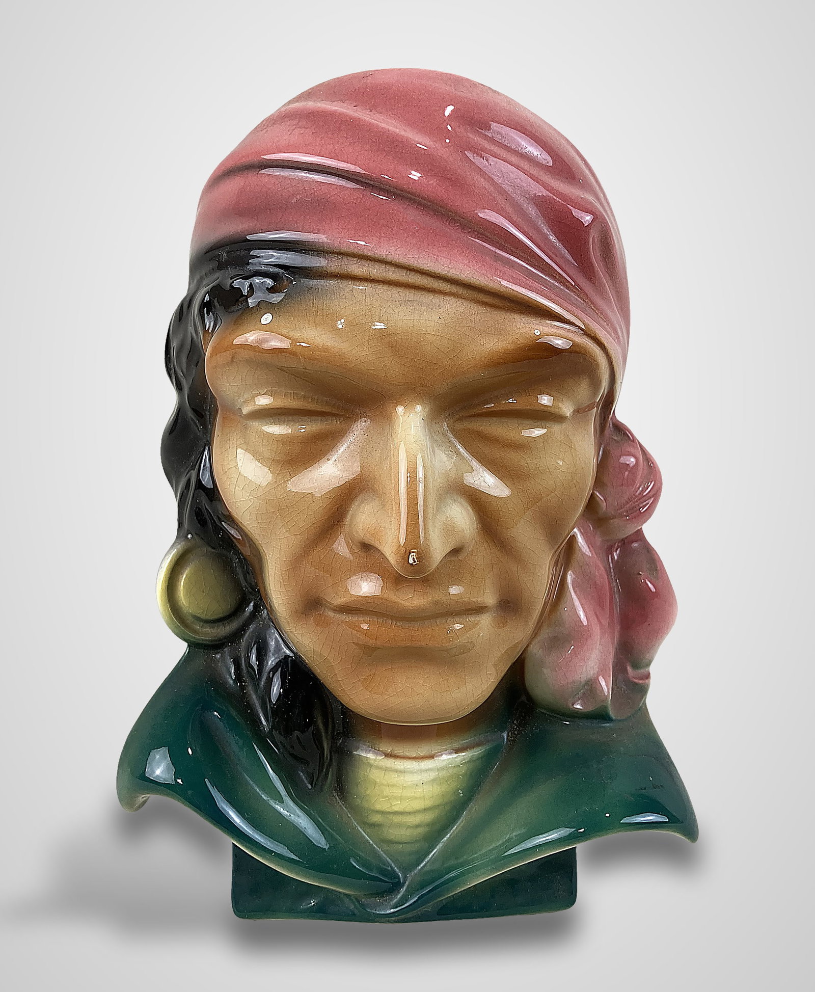 Royal Copley Pirate Bust Planter: Wall-hanging planter is modeled in the form of a pirate bust featuring vibrant coloration, including a distinctive red bandana and white collar. It measures approximately 8 1/2 in. H x 5 7/8 in. W x