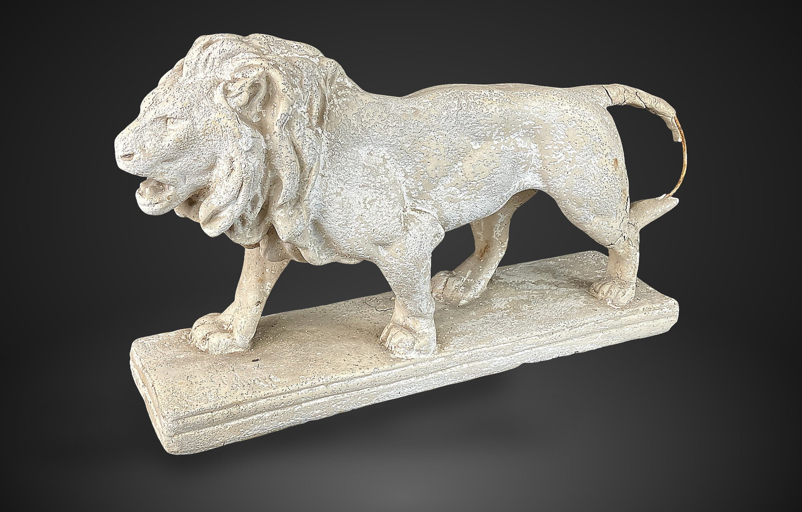 Prowling Lion Sculpture: Striking cast plaster sculpture captures a male lion on the prowl, rendered with detailed anatomical precision. The piece features an expressive face with an open, ferocious mouth. It measures