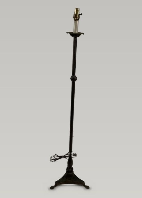Neoclassical Revival Wrought-Iron Floor Lamp: This Neoclassical-style wrought-iron floor lamp features a columnar structure with fluted lines, a baluster-form base, and terminates in shell feet. Measuring approximately 55 in. H x 13 in. in