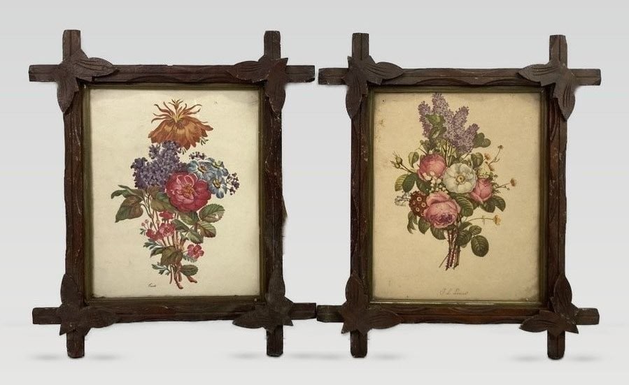 Two Botanical Prints in Criss-Cross Frames: This pair of botanical prints is housed in folk art criss-cross frames featuring expert carving, vegetal details on the corners, and classic gilt liners. The vibrant tone prints include one after