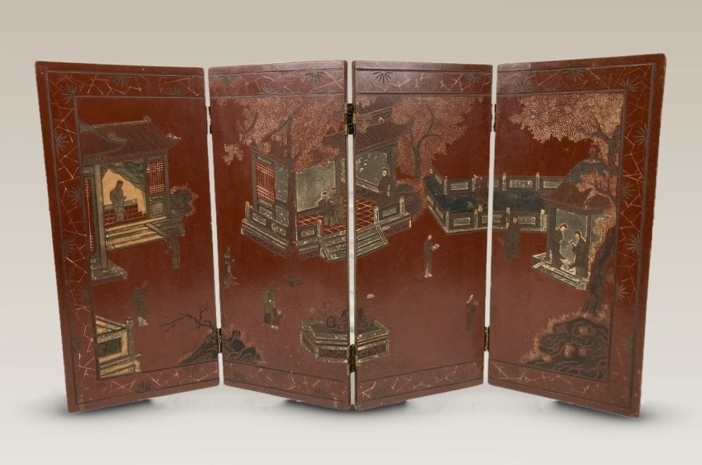 Chinese Lacquer Folding Screen: Small Chinese lacquer folding screen features a vibrant red-lacquered side adorned with detailed carved narrative motifs and figures in a landscape. The reverse side is finished in black lacquer with