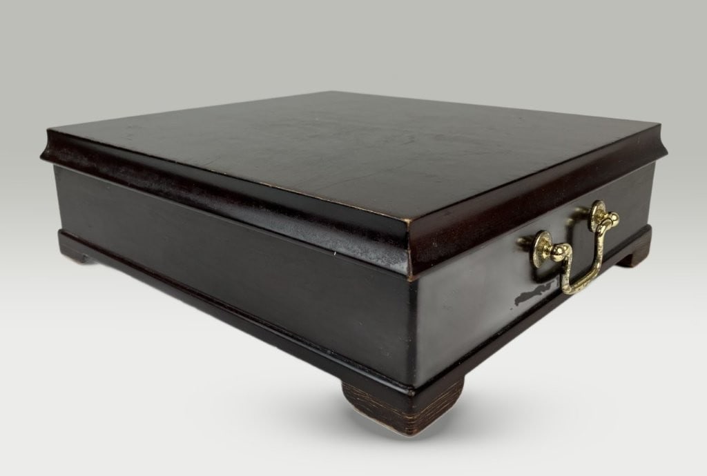 Mahogany Wood Tea Chest: Mahogany tea chest by the Bombay Company features a rich, deep finish and a decorative brass pull styled like a drawer pull. Opening to reveal green velvet-lined compartments designed for tea storage,