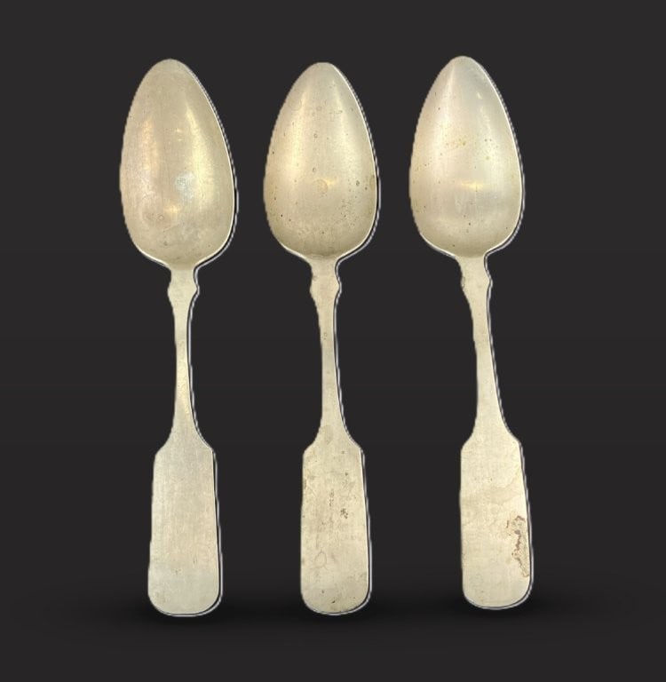 Group of Three Nickel Silver Spoons: This group of three nickel silver spoons includes one featuring pseudo-hallmarks typically used by early American silversmiths and two signed with an N by a B. The largest spoon measures