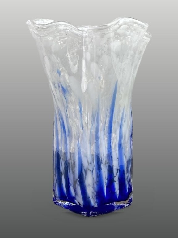 Handkerchief Art Glass Vase: This hand-blown art glass vase displays a ruffled "handkerchief" style top that tapers into a square body. The design includes blue streaks rising from the base, accented with white spot details.