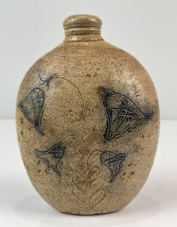 Fine 19th Century Decorated Stoneware Flask: Charming salt-glazed stoneware flask. The natural salt-glaze clay body is ornamented with delicate incised bellflower and foliate motifs highlighted in rich cobalt blue slip decoration. The flask meas