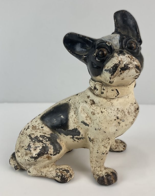 Hubley Cast Iron French Bulldog Doorstop: Early 20th-century cast iron doorstop was crafted by the Hubley Manufacturing Company, featuring a charming French bulldog with expressive, alert facial features and characteristic features. The