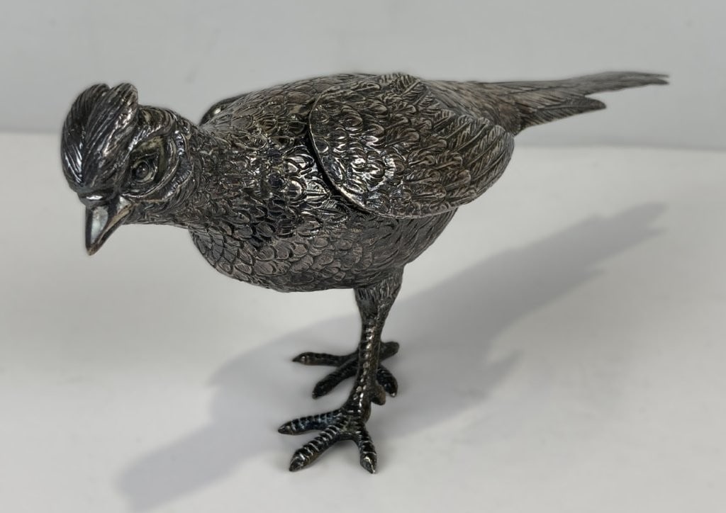American Wallace Silverplate Pheasant: Silverplate pheasant figurine is crafted by the renowned maker Wallace and features cleverly hinged, movable wings. The detailed decorative piece is stamped Wallace and EPNS on the underside. It