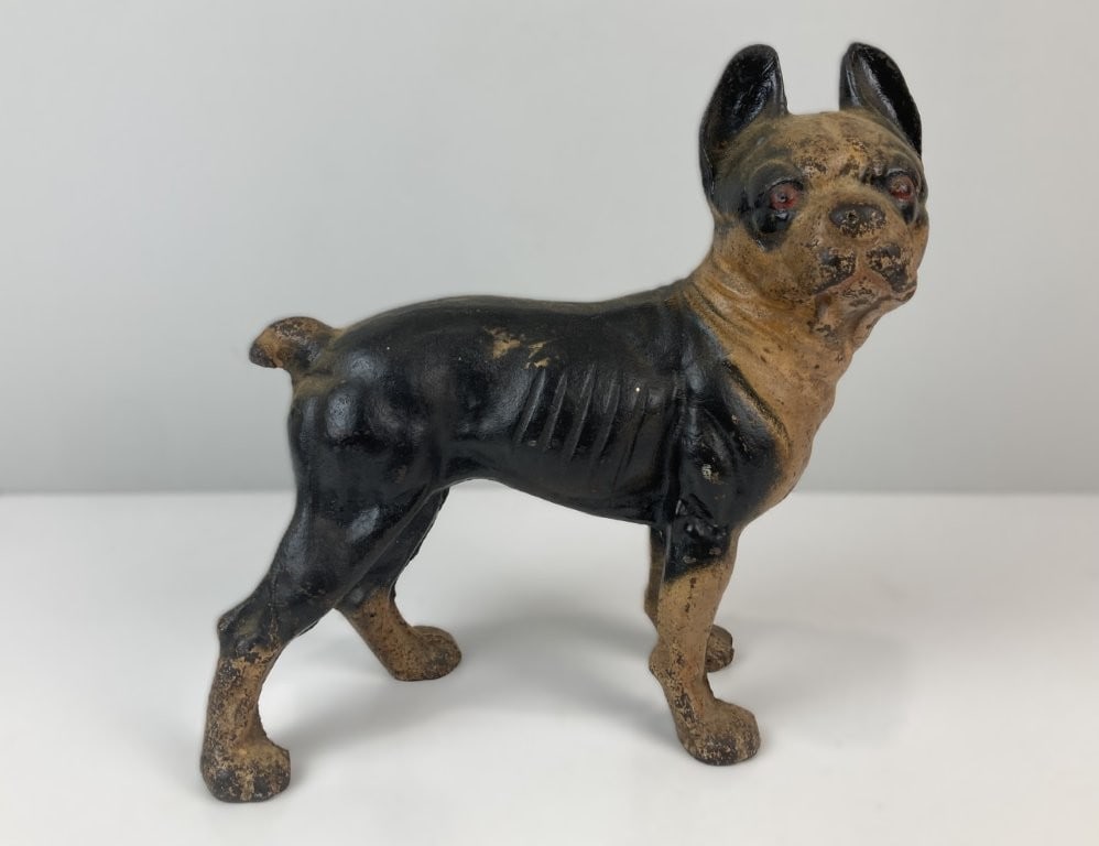 Early 20th Century Cast Iron Boston Terrier Doorstop: Handsome and collectible cast iron doorstop depicts a perky Boston Terrier rendered in the classic decorative style of the Hubley Manufacturing Company. The solid, weighty sculpture features a