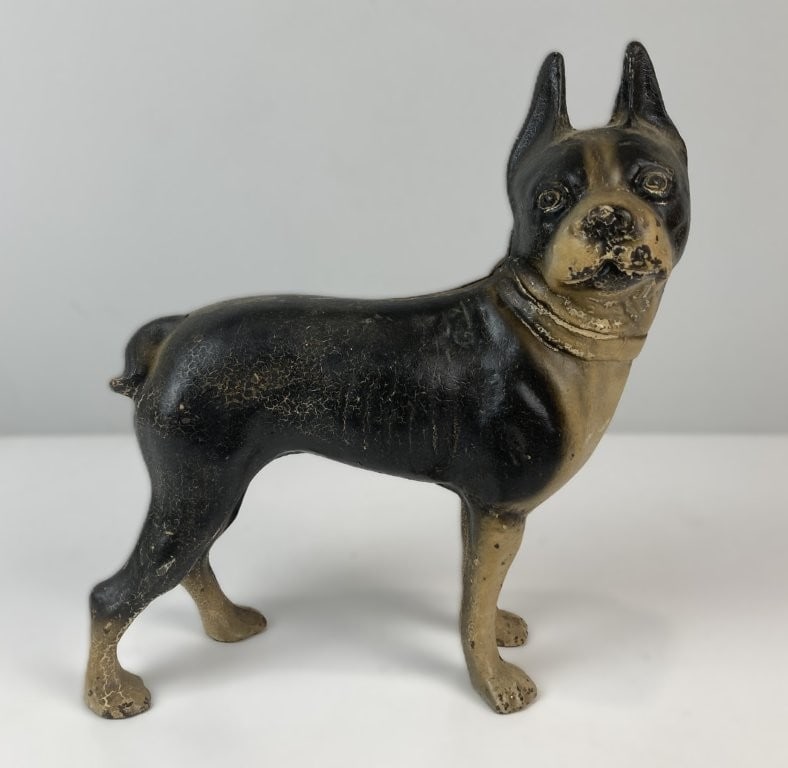 Early 20th Century Cast Hubley Iron Boston Terrier Doorstop: Cast iron doorstop depicts a perky Boston Terrier rendered in the classic decorative form attributed to Hubley Manufacturing Company. The solid, weighty sculpture features a charming polychrome