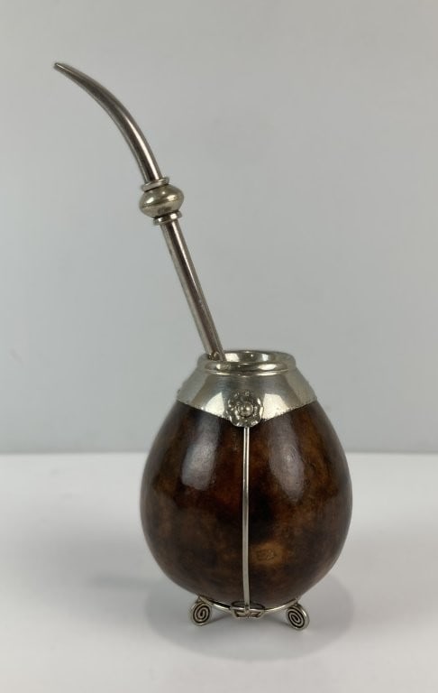 Argentine Sterling Silver-Mounted Yerba Mate Gourd Cup with Bombilla: Traditional Argentine yerba mate gourd cup is elevated by elaborate, hand-wrought sterling silver mounts and floral ornamentation, capturing the classic craftsmanship of South American gaucho culture.