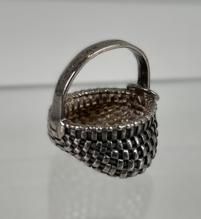 Sterling Silver Brown County Basket Charm: This charming miniature sterling silver charm takes the iconic form of a traditional Southern buttocks basket, capturing the classic woven texture and distinctive bowed shape in miniature. Versatile