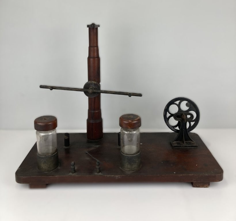 Late 19th-Century Electrostatic Influence Machine: This scientific instrument features an electrostatic influence machine constructed with traditional wooden components. The educational and laboratory apparatus measures approximately 17 1/8 in. H x