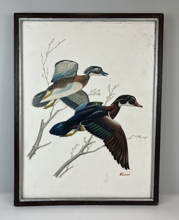 Ducks in Flight, Wildlife Oil Painting: This masterfully executed mid-to-late 20th-century oil painting by artist N. Cunan showcases exceptional naturalism in wildlife art, depicting a pair of wood ducks captured in mid-flight against a