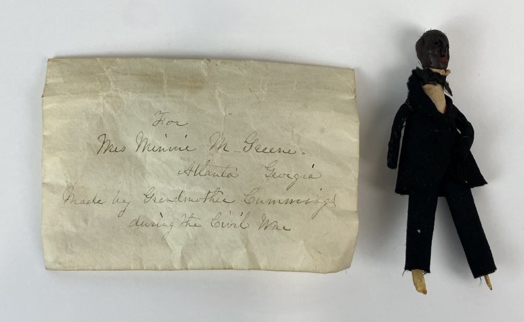 Early Black Americana Folk Art Doll: This rare early folk art doll, originating from the Southern United States and attributed to the Civil War era based on accompanying provenance notes, was handmade for Mrs. Minnie M. Greene of Atlanta