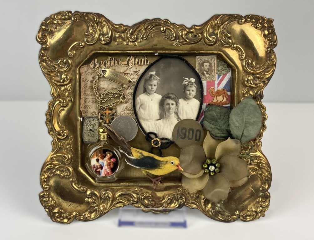English Memento Photograph Assemblage: This unique English memento photograph assemblage, or 3D collage, features a central turn-of-the-century family photograph creatively housed within a brass scrollwork frame from an English-made