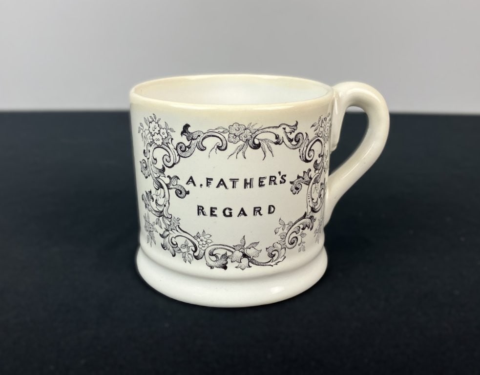 Mottahedeh Childs Mug: Charming childs mug was crafted in Portugal by the renowned firm Mottahedeh, paying tasteful homage to the classic 19th-century transferware tradition. The white porcelain vessel features a