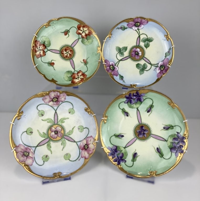 Hand-Painted E.W. Donath Art Nouveau Porcelain Plates: Exquisite set of four porcelain plates was executed by Edward W. Donath, a renowned Bavarian-born porcelain artist who worked in the United States. Featuring graceful Art Nouveau styling, each piece