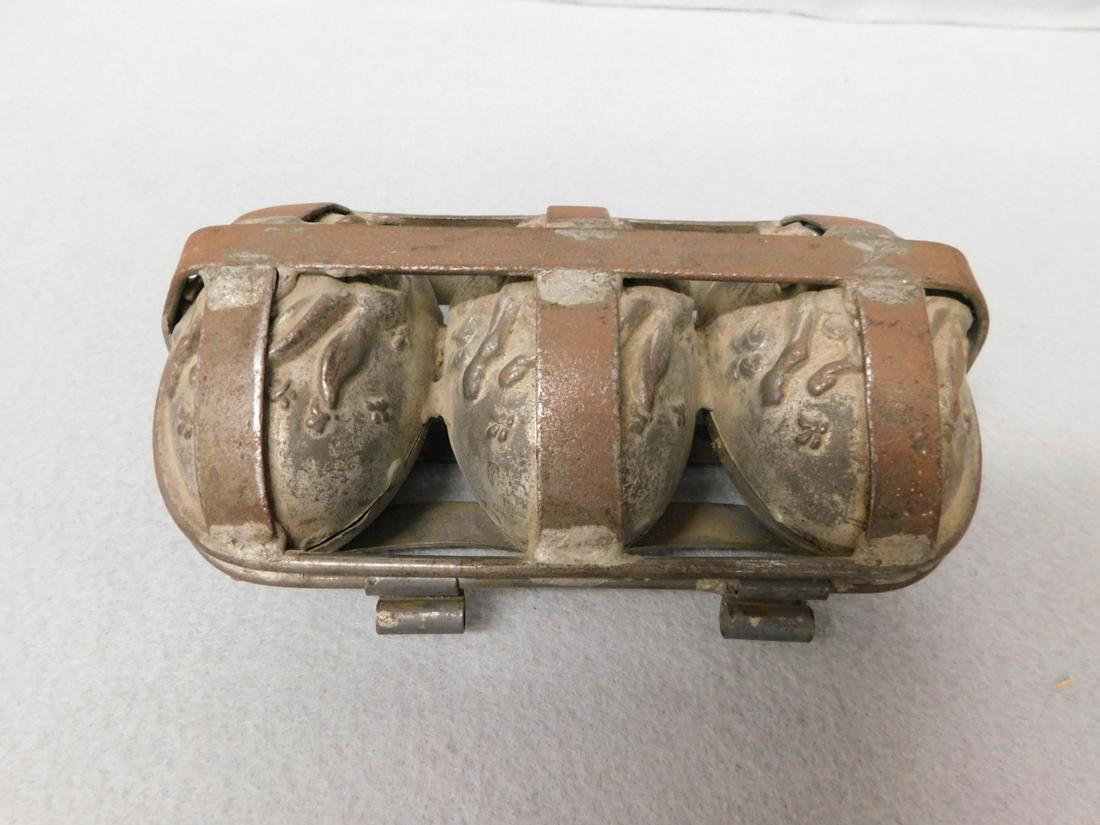 Early Easter Egg Mold: Early Easter egg chocolate mold depicting running bunnies in flowers