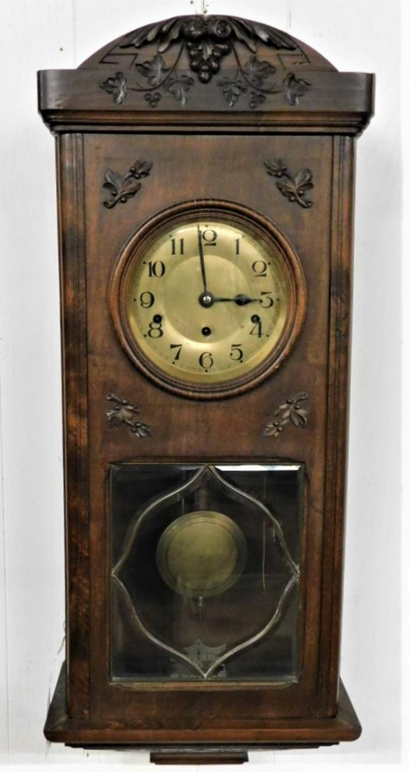 German Time & Strike Wall Clock: German Time & Strike 30 Day Wind in a Carved Walnut Case Wall Clock - 35in.H.x 14in.W., All Clocks Sold As Found