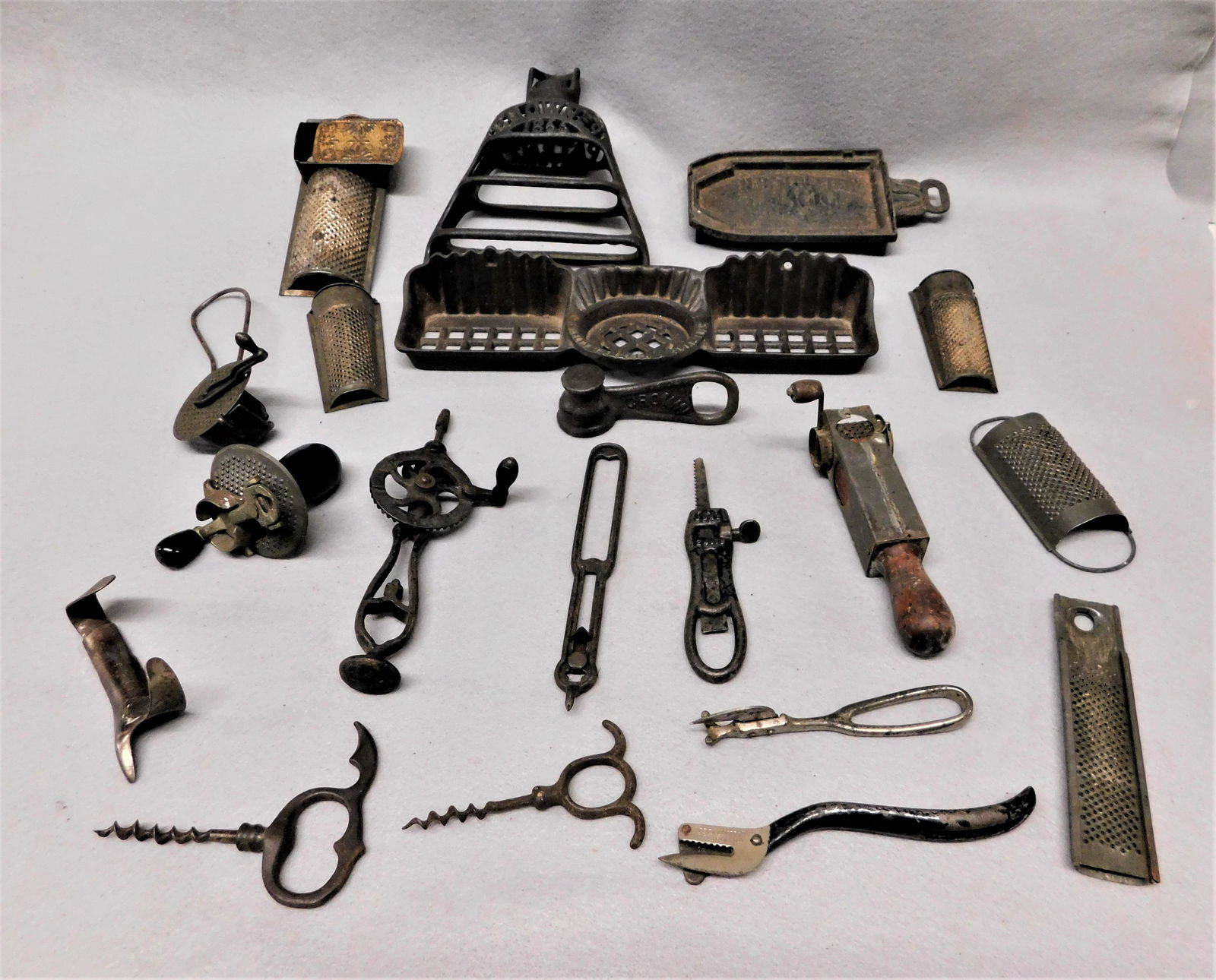 Lg. Lot of Early Iron Kitchenwares: Lg. Lot of Early Iron Kitchenwares incl. Unique Grinders, Corkscrews, Soap Dish, Graters, Corn Shucker, Etc. in VG Cond.