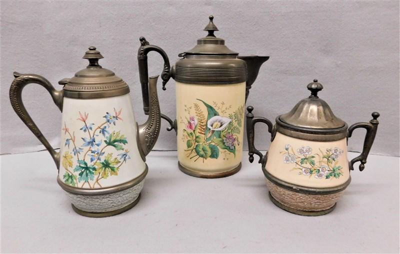 Lot of Three(3)Pcs. Pewter Graniteware: Lot of Three(3) Pcs. Pewter Graniteware:Teapot, Coffee Pot, and Sugar in Floral Motif., Teapot 8 1/2"H, Coffee Pot 11", Sugar 7" H