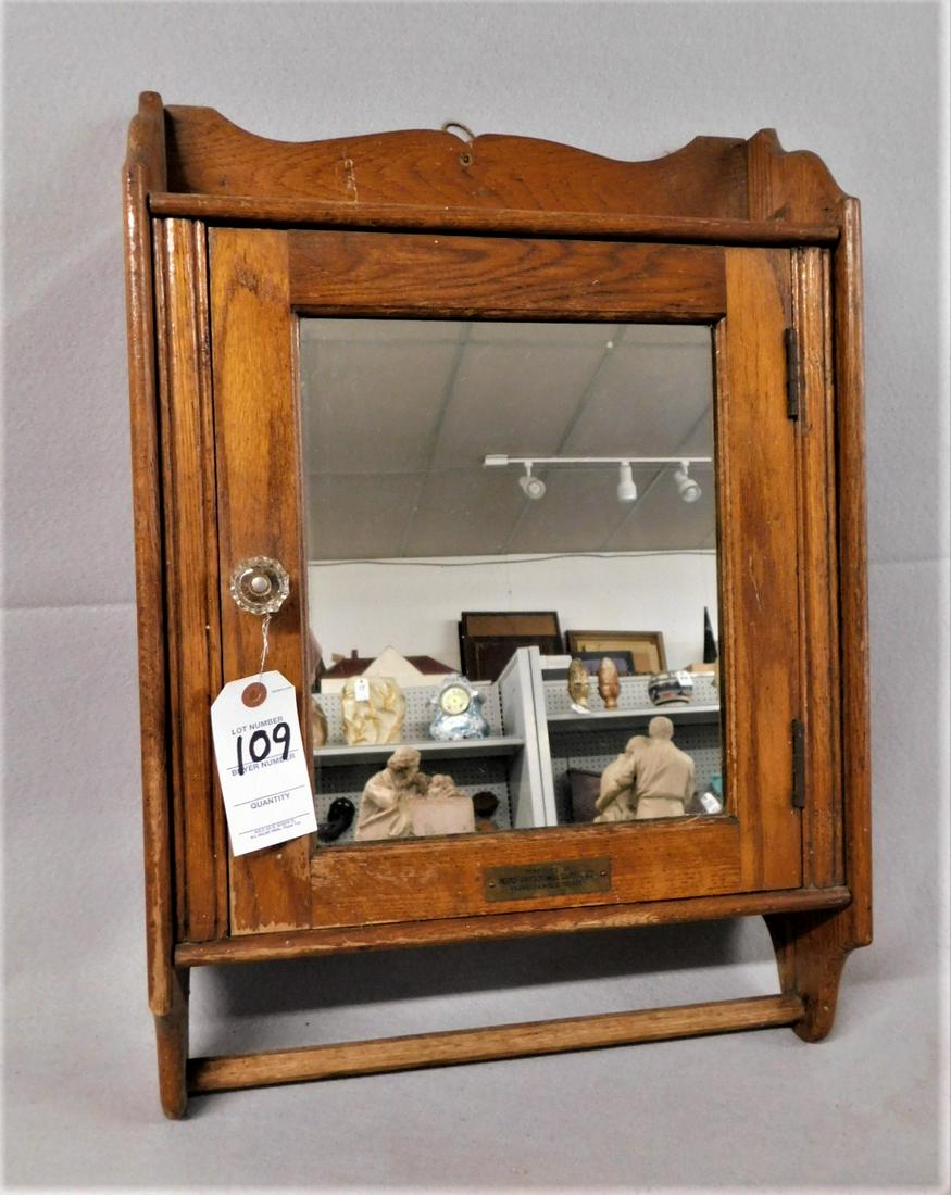Oak Medicine Cabinet: Oak Wall Medicine Cabinet w/Towel Bar & Mirror - Brass Plaque on Frt. "Merchant's Towel Supply Co., Norfolk Ave. Roxbury" - 16 1/2in.W. x 24 1/2in.H.