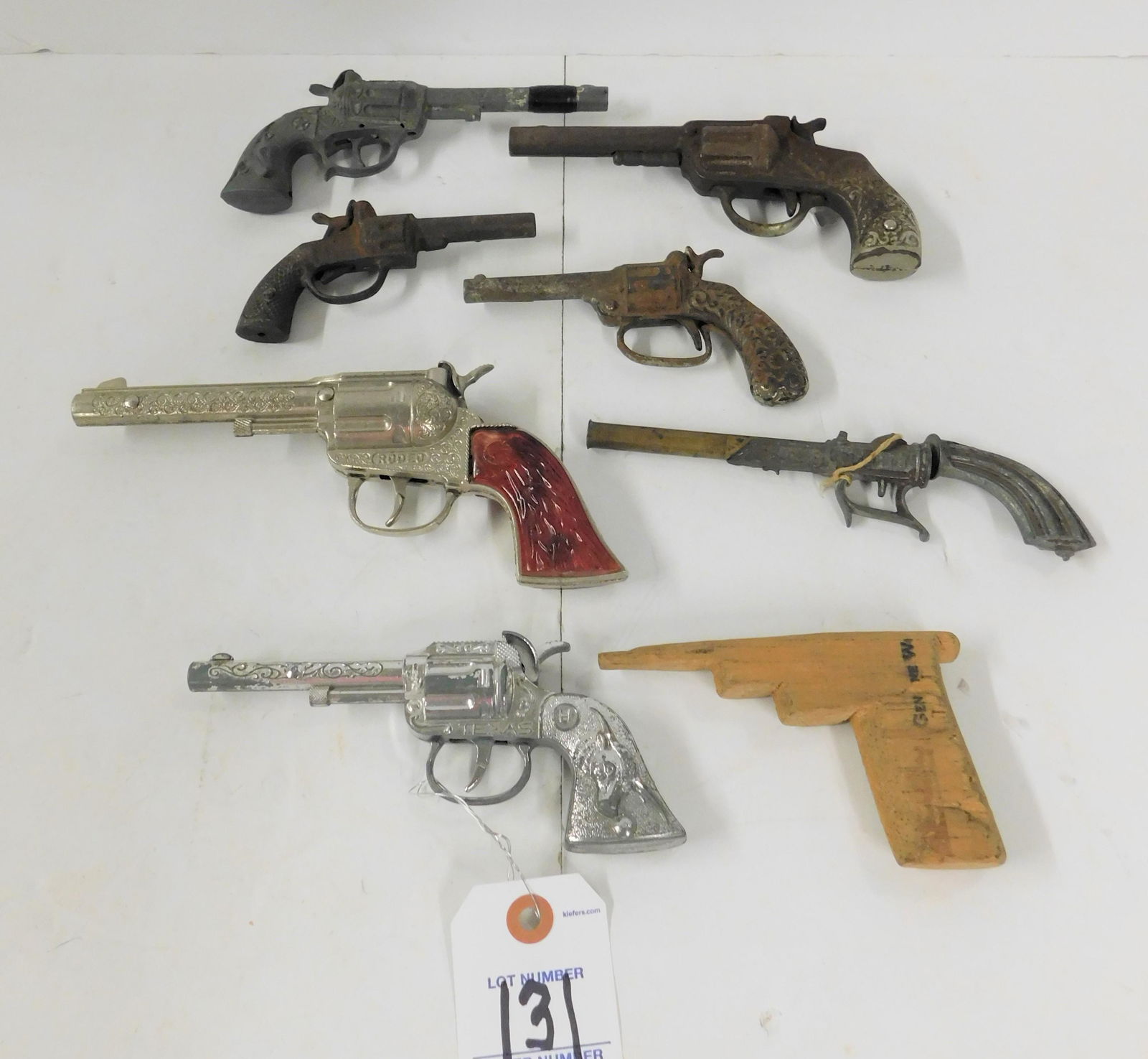 Lot of 6 Toy Cap Guns: Lot of 6 Toy Metal Cap Guns, 1 Wooden Cut Out in Fair to GD Cond.