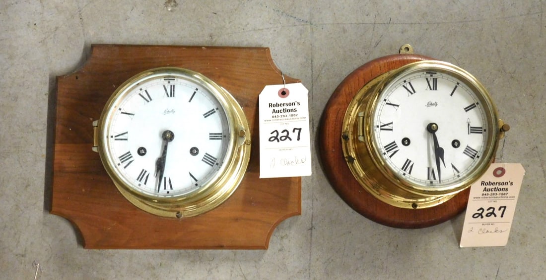 2 Brass Ship's Clocks: 2 Brass Ship's Clocks Marked "Schatz" on Wood Mounting C. 1930 in Gd Cond. - 7 1/2" x 7 1/2"; 7"x7" Clocks Only - Please Note: We are not shipping clocks & Firearms. Shipping for Firearms & Clocks mus