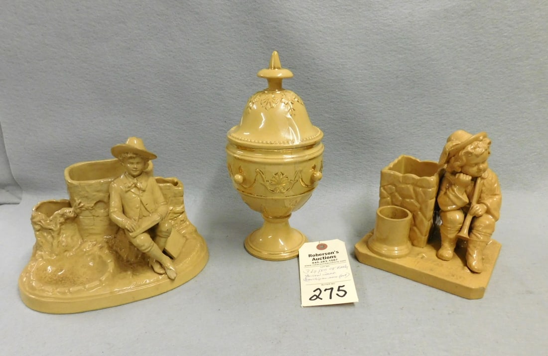 3 Lg. Pcs. of Early Figural Yellow Ware: 3 Lg. pcs. of Early Figural Yellow Ware Incl. Flute Player at Well (Sm. Chip on Corner); Boy w/Book by Stone Wall (Chip on Rght.Ft.), Compote w/Lid, Otherwise in Gd Cond.