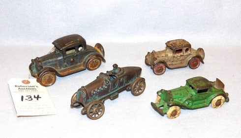 4  Early Iron Toy Vehicles