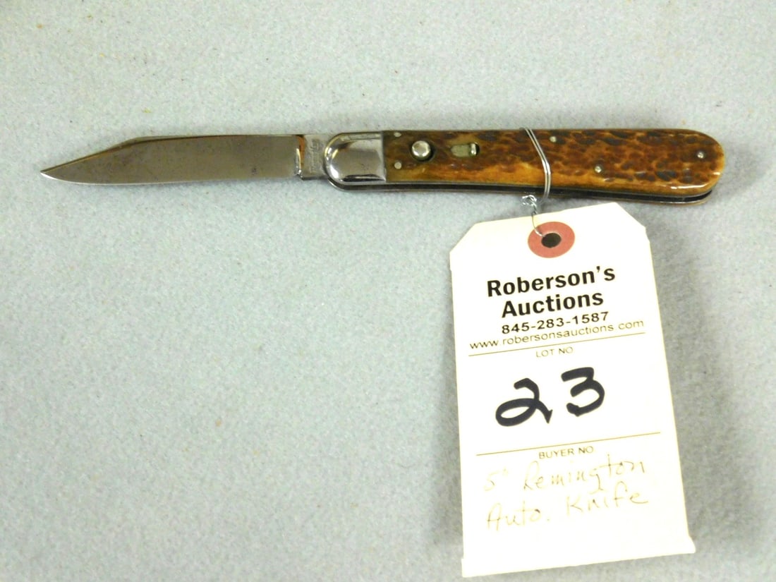 Remington R2403 Automatic Knife: Remington R2403 Automatic Knife w/Jig Bone Hdls., Some Wobble, 1 - Small Surface Crack at Bolster on Pile Side - 5in. in Gd. Cond.