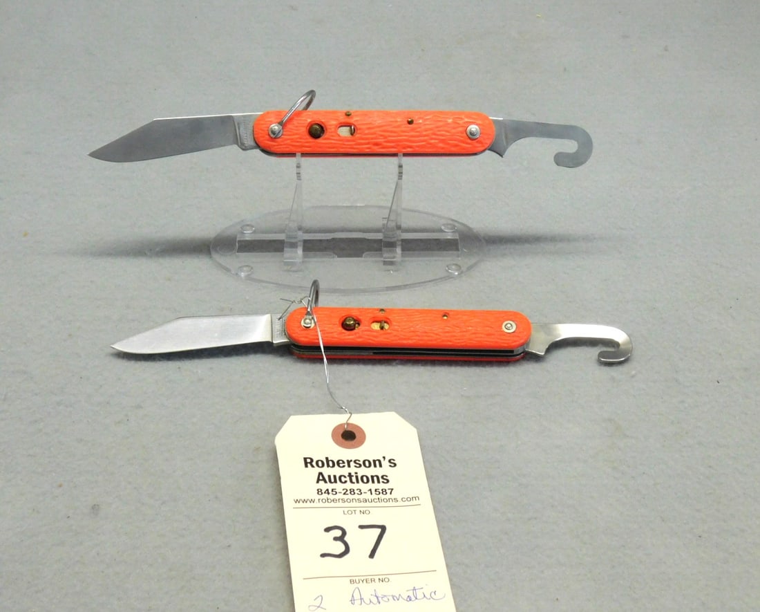 2 - Automatic Paratrooper Knives: 2 - Automatic Paratrooper Knives: 1 - Camillus 4 1/4" w/Shoud Cutter, Red Plastic Handle, Bit of Wobble; 1 - Logan Smyth 4 1/4" w/Shoud Cutter, Red Plastic Handle, Bit of Wobble in VG Cond.