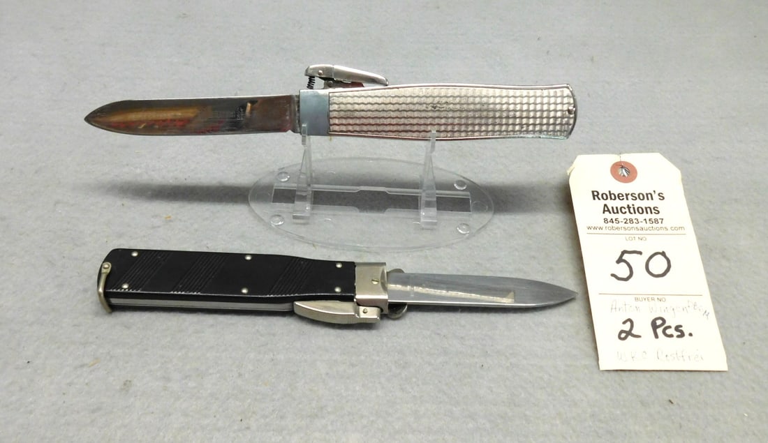 2 - Trap Door Knives: 2 - Trap Door Knives: 1 - Anton Wingen DBGM Trap Door Knife, Missing Door w/ Metal Handles 5 1/4" in Gd. Cond.; 1 - WKC Rosfrei Trap Door Knife w/ Black Plastic Handles w/Emblem, No Cracks 5 1/4" in