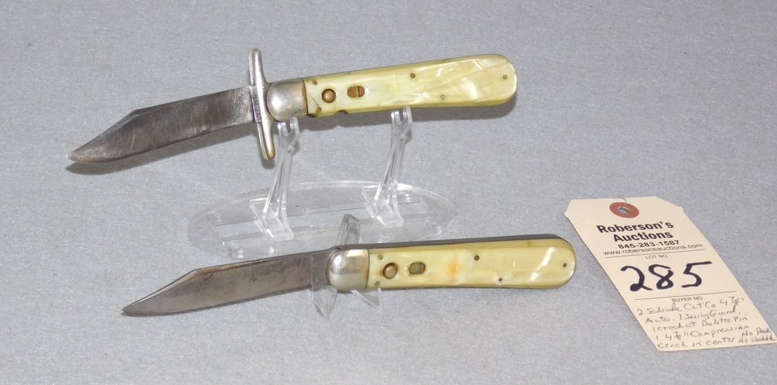 2 - Schrade Cutco 4 7/8"Automatic Knives: 2 - Schrade Cutco 4 7/8" Automatic Knives: 1)Swing Guard w/Celluloid Handles, Crack at Bolster Pin on Mark Side, Fires Great; 1 )Celluloid Handles, Has Shallow Compression Crack in Center of Handle, F