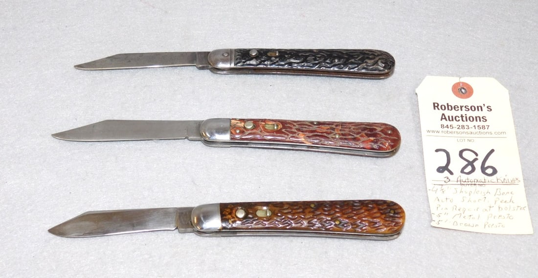3 - Automatic Knives: 3 - Automatic Knives: 1) Shapleigh Hardware Made by Schrade - 4 7/8" w/Bone Hdls., Repair at Front Pin at Bolster; 1) Presto Knife - 5", All Metal Hdls.; 1) Presto Knife - 5" w/Brown Hdls., No Cracks;