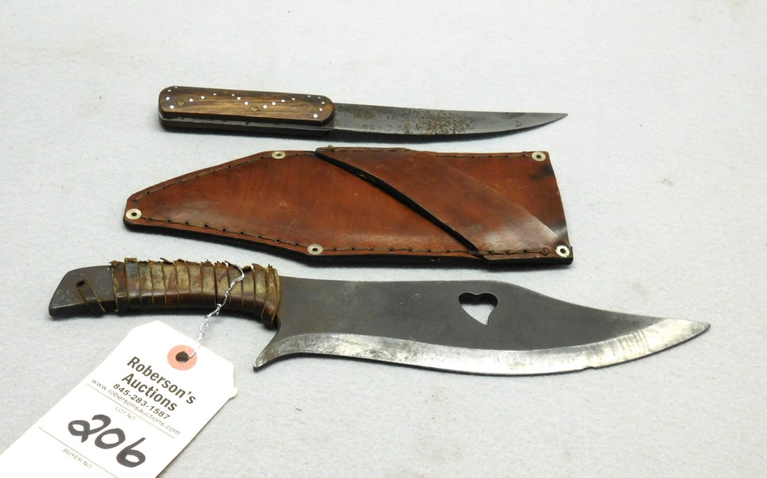 2 - Early Knives: 2 - Early Knives, 13"L w/leather handle & heart cutout in blade marked "GF75" Poss. Geo. Fischer (Swiss) w/sheath; 9-1/2" L. Metal Inlay handles w/curved blade Poss. Native American, Both in Gd. Cond.