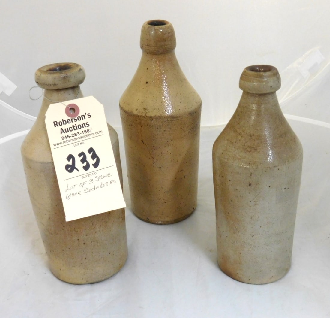 3 - Stoneware Soda Bottles: 3 - Stoneware Soda Bottles in GD Cond. - 2- 10"H, 1-11"H; (The 11" Has A Chip) Otherwise in Gd. Cond.