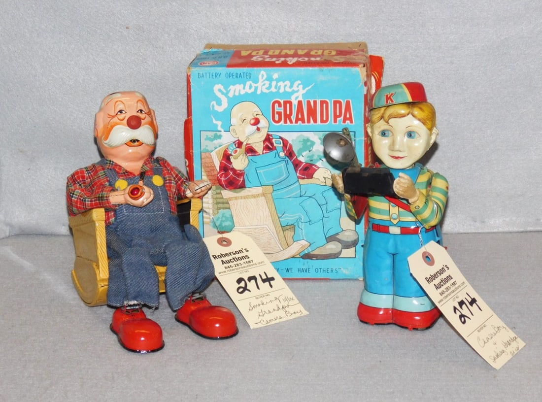 Smoking Grandpa & Camera Boy Toys: Battery Operated Smoking Grandpa & Camera Boy Toys in as is non-working cond. Good color on both. Grandpa w/Bx : Box 8-1/2" x 6-3/4 x 4-3/4; Boy 9"