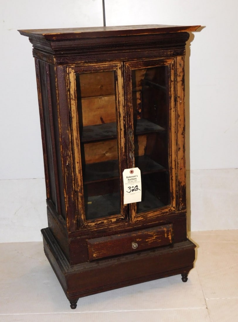 Early Diminuitive China Cabinet: Early Diminuitive Dbl. Dr. 1 Drwr. Table Top or Floor China Cabinet w/Molding & Feet in Fair Finish Otherwise in GD Cond. 36"H x 20"W x 14 1/2"D