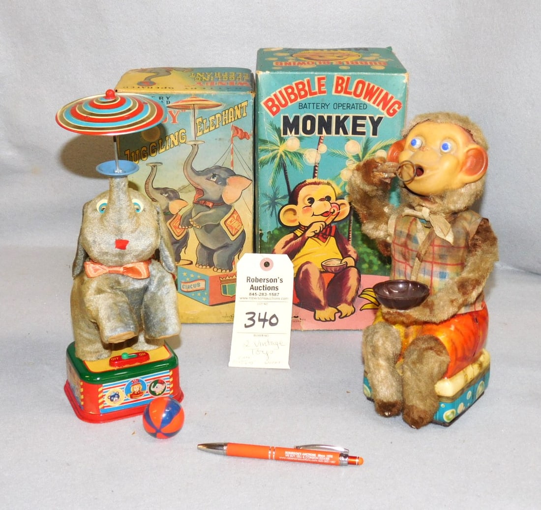 2 - Vintage Battery Operated Toys: 2 - Vintage Battery Operated Toys- Monkey w/ Bubbles (Not Working) & Elephant Twirling Umbrella (Working) -Cases- 10" x 7 1/2" x 5" ; 11x6x5 1/2"